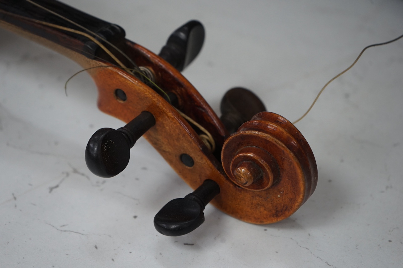 A cased full length violin, circa 1900 with bow, bears Stradivarius label to the interior. CITES Submission reference WVME8714